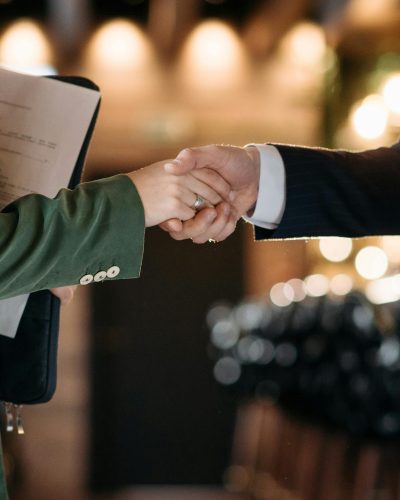 Close-up of two professionals shaking hands, symbolizing a successful partnership agreement.